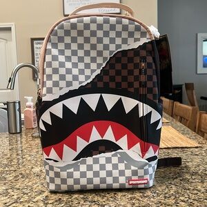 Spray ground backpack